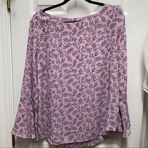 Blouse with black pattern and bell sleeve detail